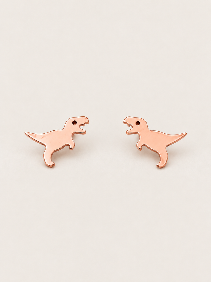 Rose Gold T. Rex Stud Earrings shown on a warm neutral background