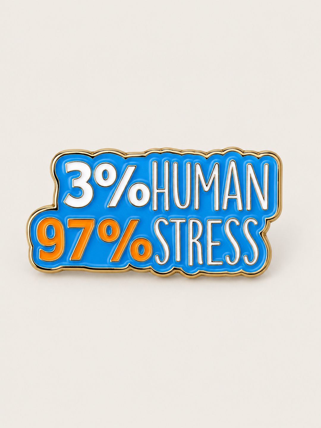 3 Percent Human 97 Percent Stress Pin shown on a warm neutral background