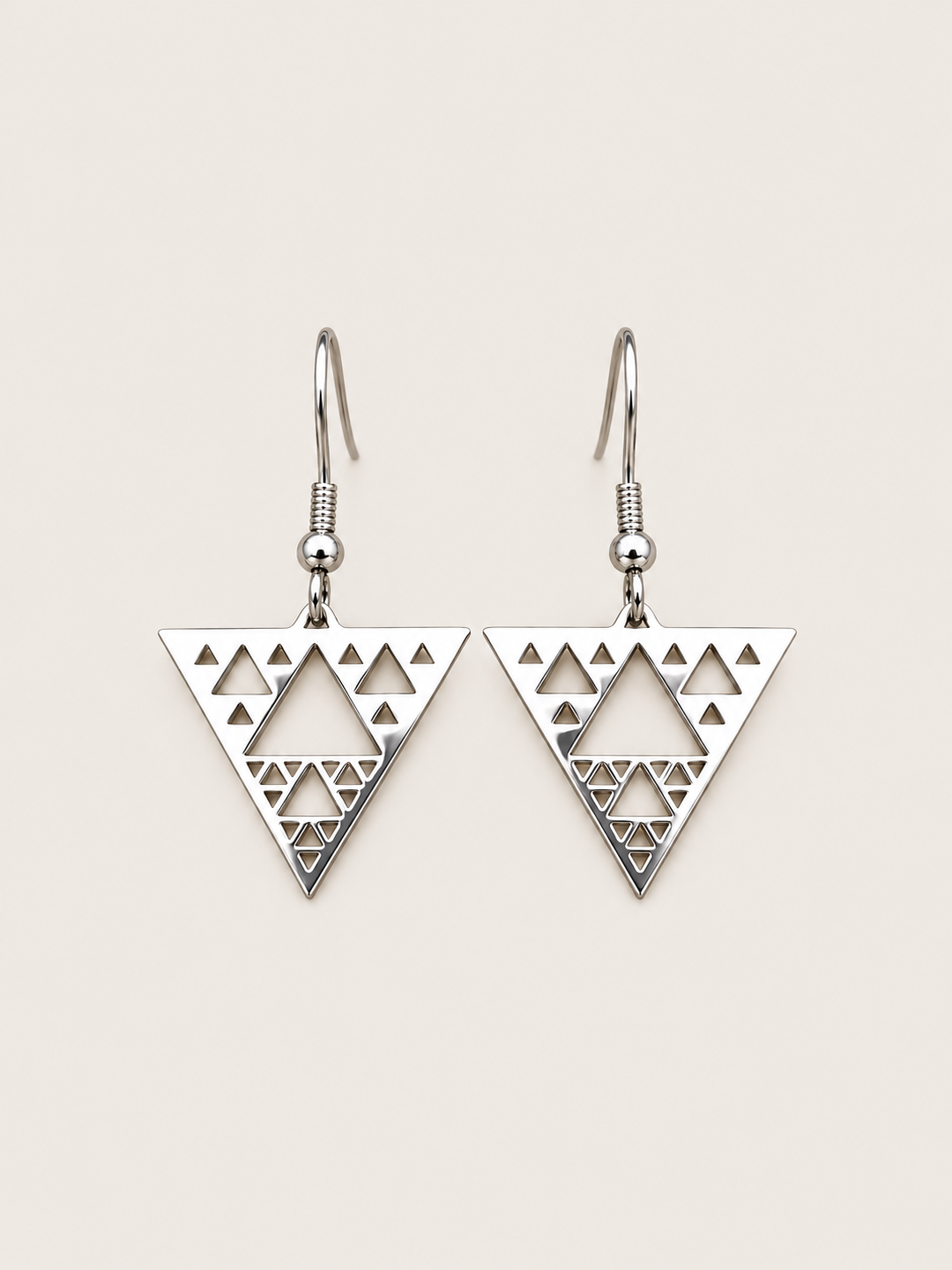 Silver Triangle Cutout Drop Earrings shown on a warm neutral background