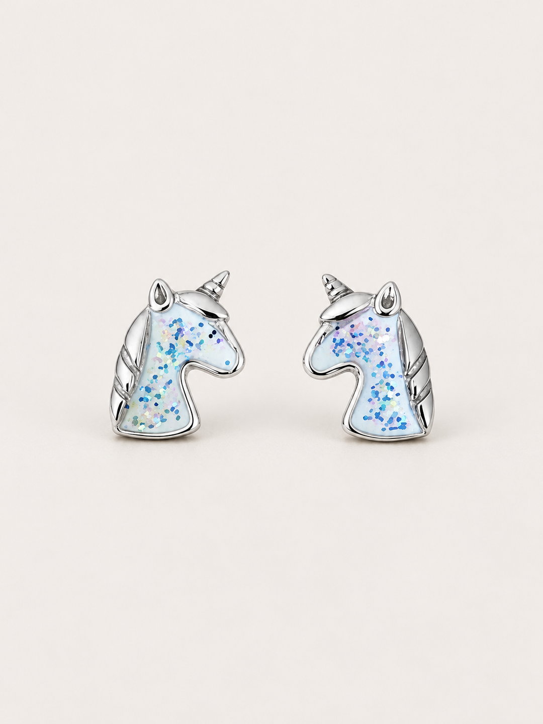 Unicorn Stud Earrings shown on a warm neutral background