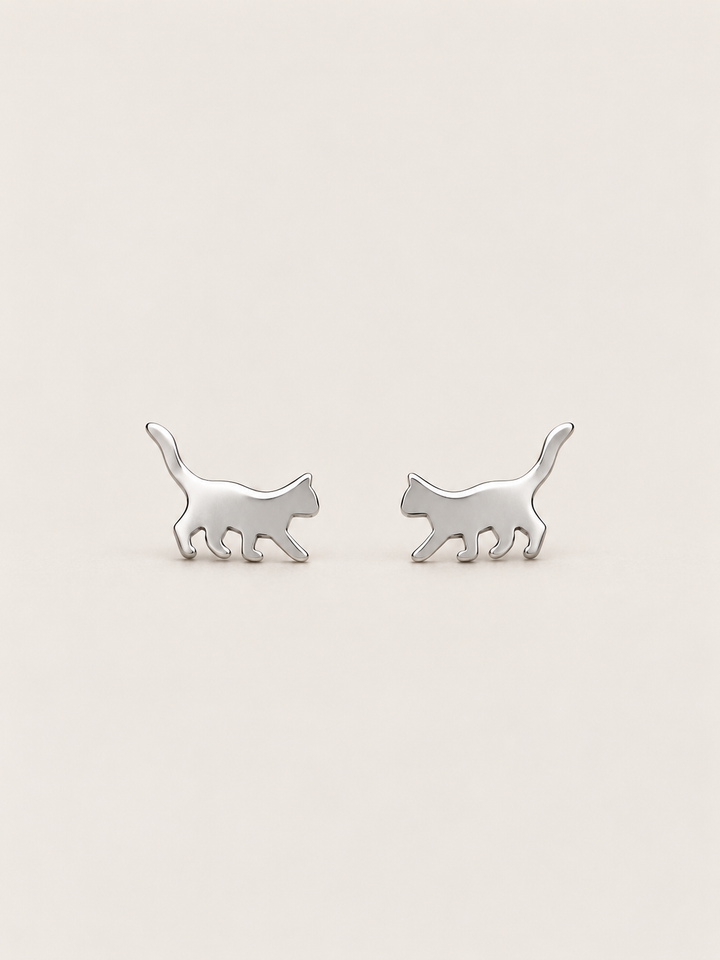 Silver Walking Cat Stud Earrings shown on a warm neutral background