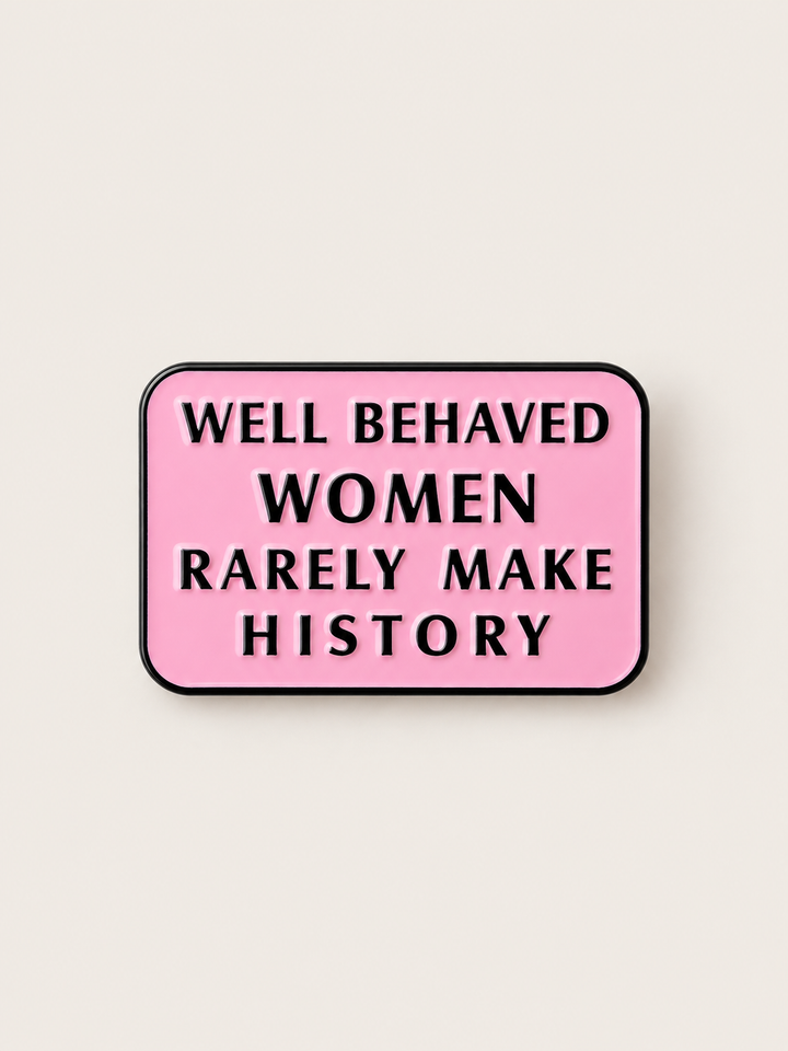 Well Behaved Women Rarely Make History Pin shown on a warm neutral background