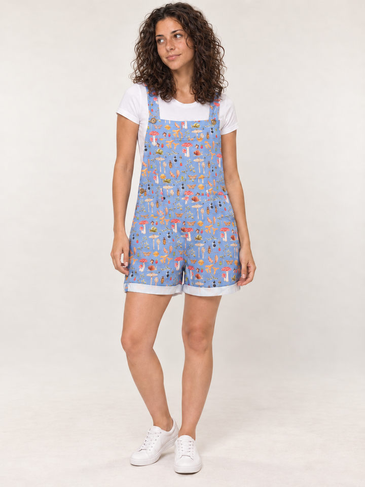 Model wearing Woodland Mushroom Short Overalls Blue, full-body front view