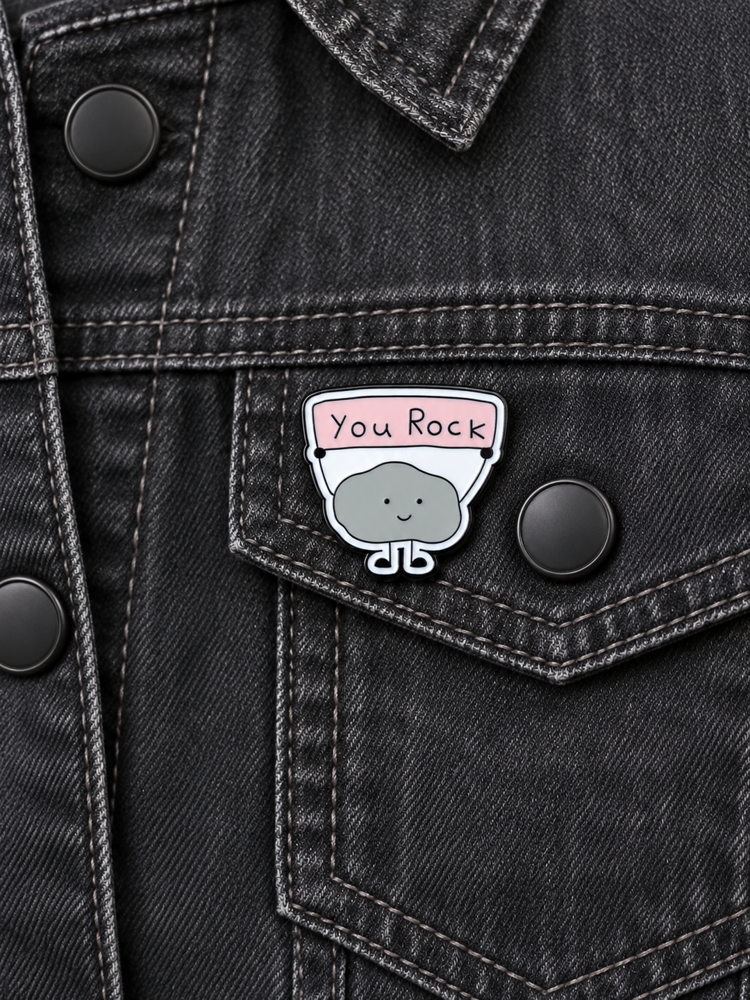 You Rock Cute Rock Pin displayed on a charcoal denim jacket beside a metal button