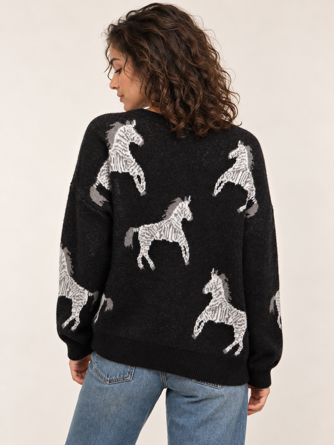 Model wearing Zebra Sweater Black, back view