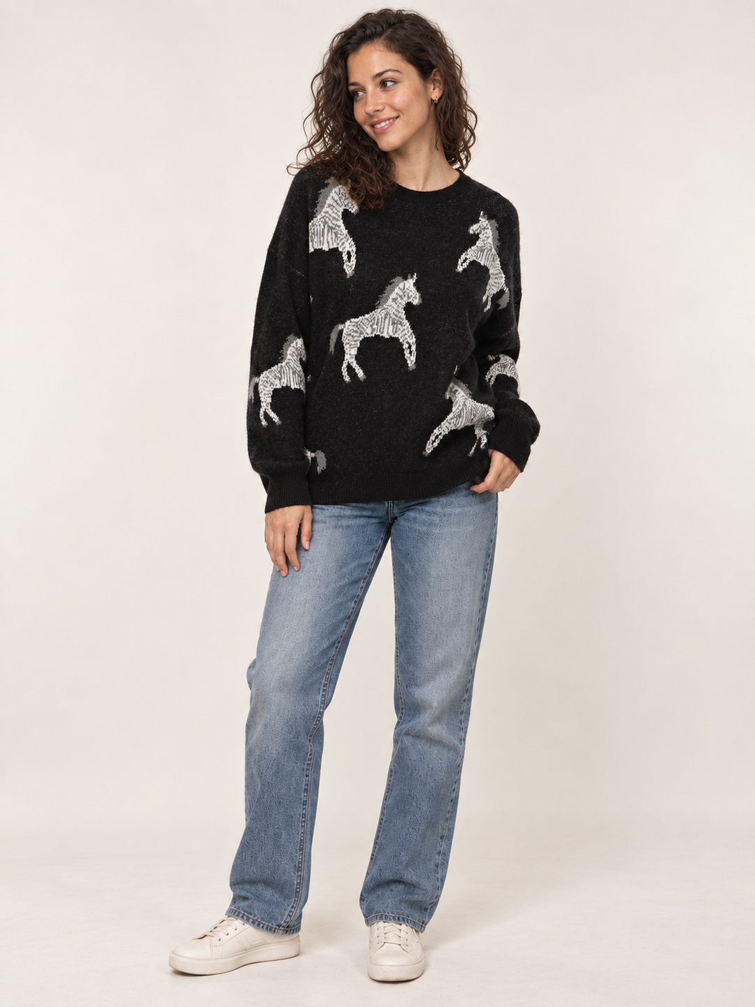 Model wearing Zebra Sweater Black, full-body view