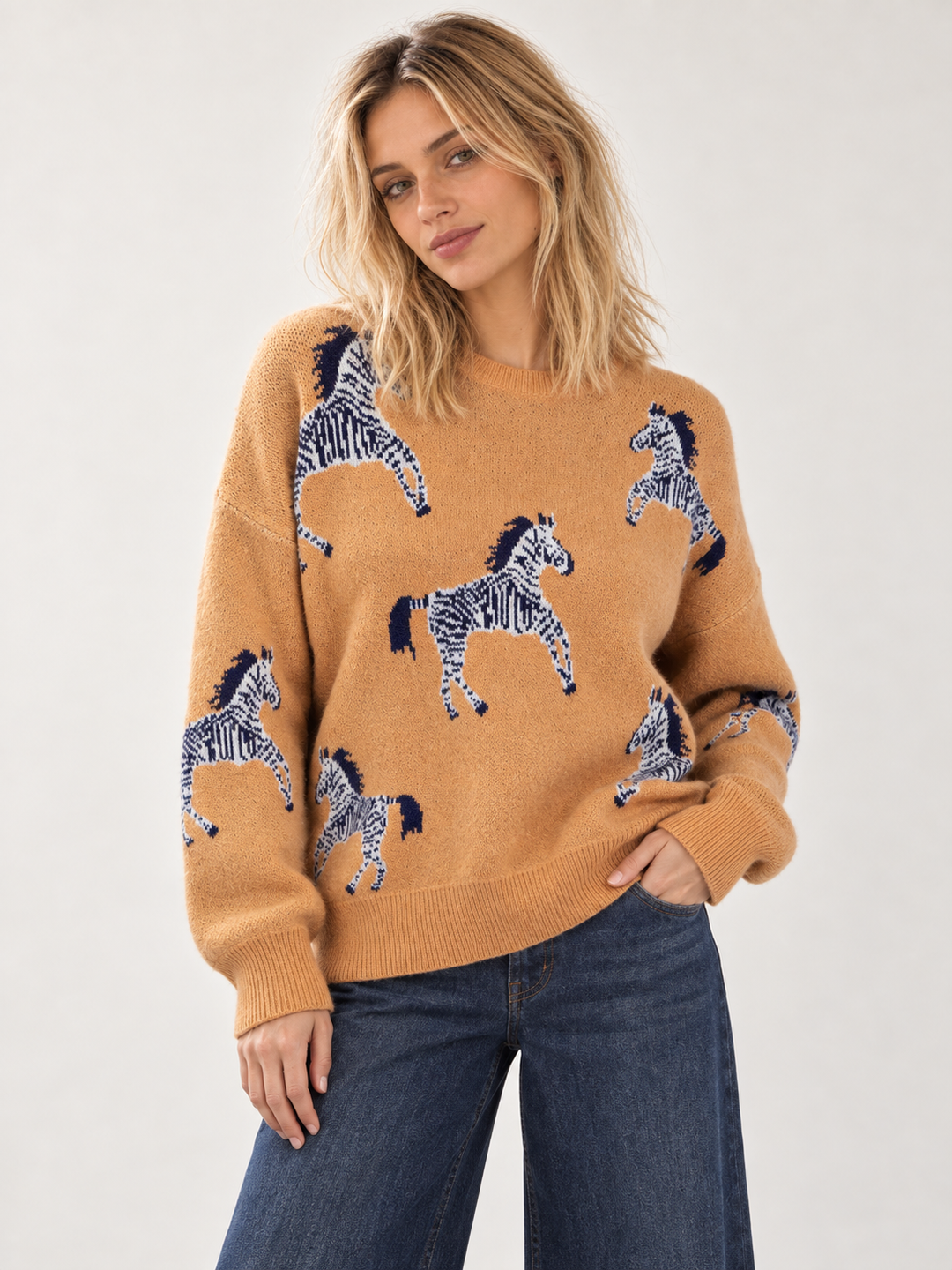 Front view of Zebra Sweater Tan on model